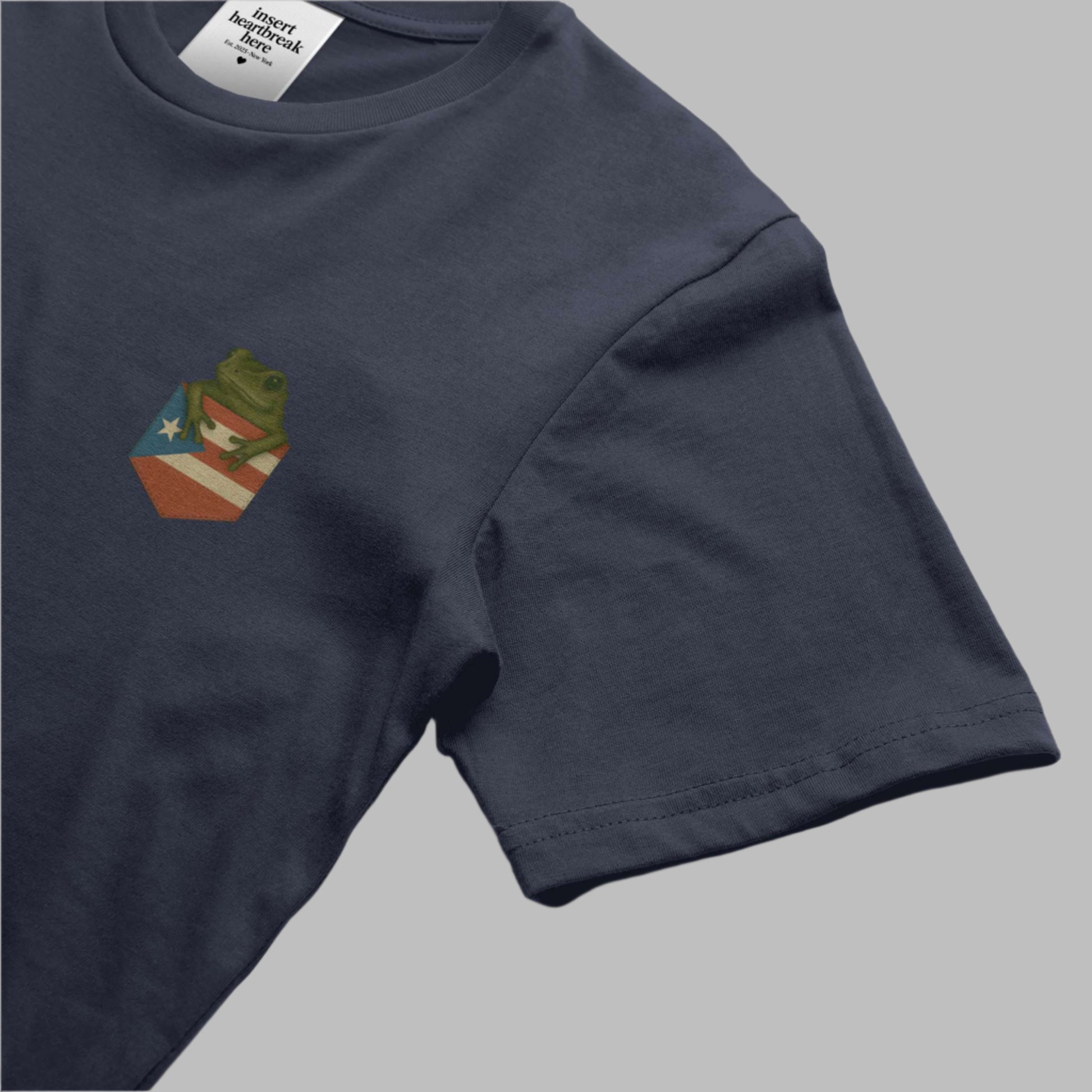 Navy blue t-shirt with a small graphic on a white background